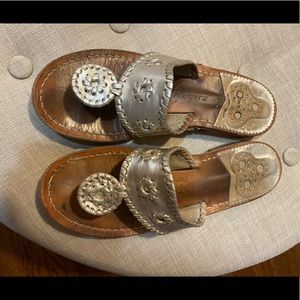 Well loved gold Jack Rogers sandal